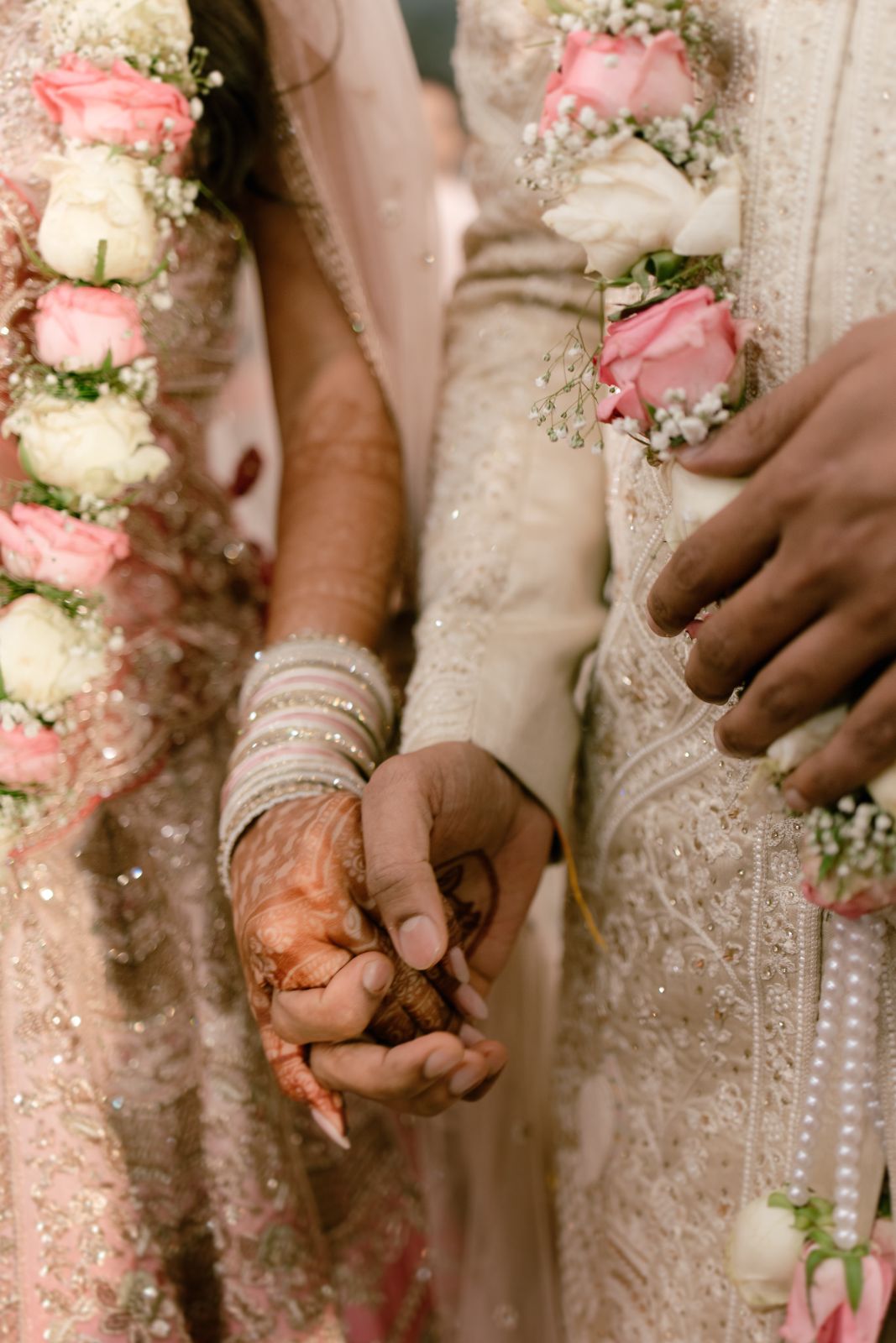 Hands, mehendi and garlands