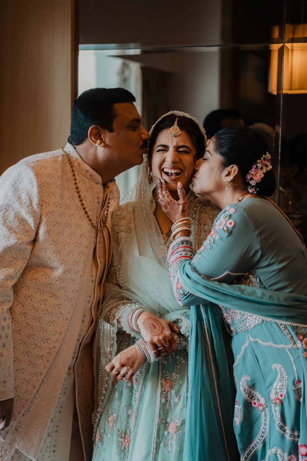 The bride laughing with her family