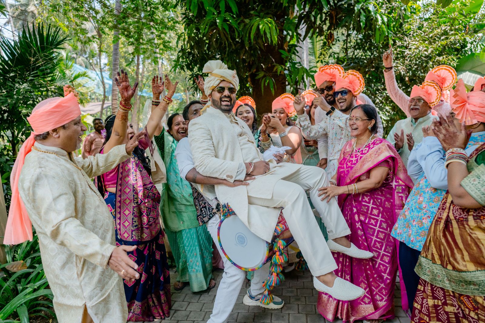 The groom lifted by his family at the baraat